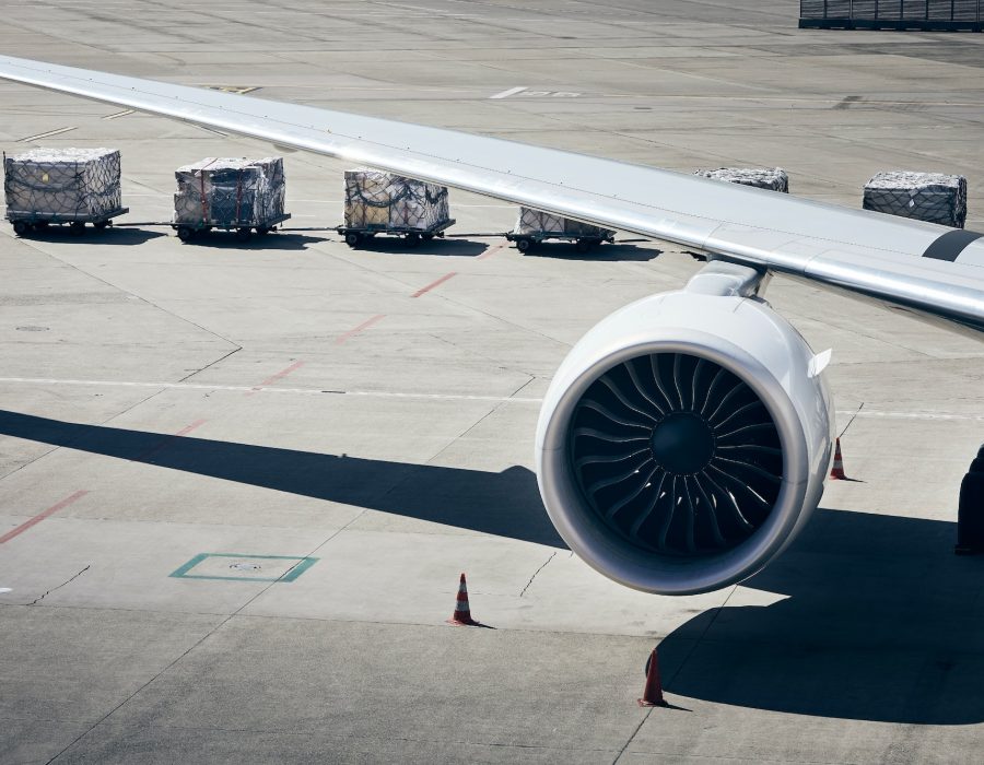 Loading of cargo containers to plane at airport